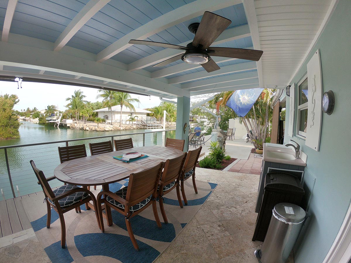 Outdoor Dining Room can easily seat 10 with 2 chairs from the inside dining room. Features wet bar under kitchen window